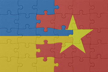 puzzle with the national flag of ukraine and vietnam . macro.concept.