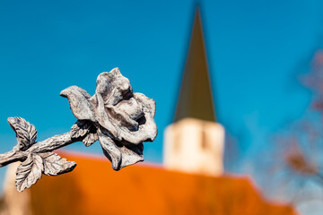 Details of a stone rose with a church at Mamming, Dingolfing-Landau, Bavaria, Germany
