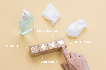 Doctor hand arranging wood block stacking with healthcare icon concept, insurance for your health.