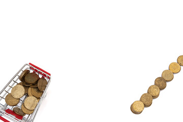 Shopping cart full of coins on white background, shopping concept