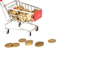 Shopping cart full of coins on white background, shopping concept