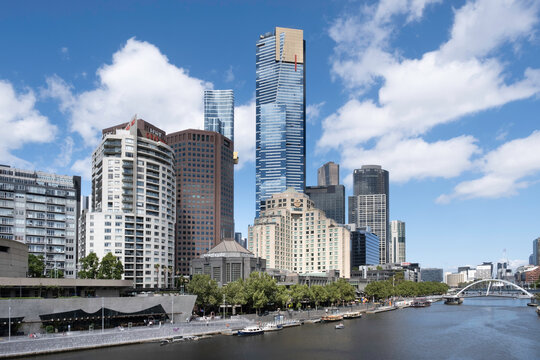 MELBOURNE, AUSTRALIA - FEBRUARY 18 2023: Melbourne cityscape with buildings, Eureka tower and other skyscrapers at the Yarra river. Blue cloudy sky