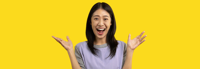 Asian woman acting shocked or surprised isolated on a white background,  Looking camera, Concept acts according to the emotions and feelings of excitement and shock, Yellow background, Copy space.
