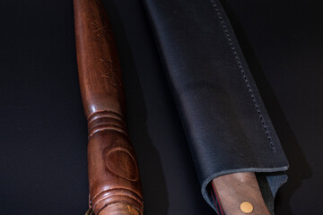 Damascus steel knives on a black background. Kitchen knives. background with japanese knife. A set...