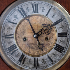 Fototapeta na wymiar Vintage Clock with Hands.Close up view on clock face of a historical watches with golden frame