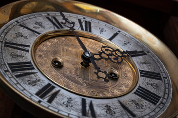 Vintage Clock with Hands.Close up view on clock face of a historical watches with golden frame