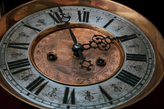 Vintage Clock with Hands.Close up view on clock face of a historical watches with golden frame © Alexander Odessa 