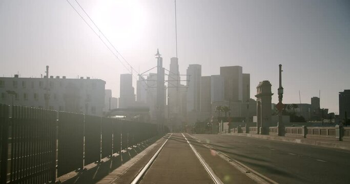 Empty street with tramway and skyline in the background on a sunny day during the Lockdown