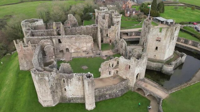 Aerial video of an old abandoned building of Raglan Castle, Wales