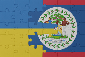 puzzle with the national flag of ukraine and belize . macro.concept.