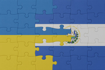 puzzle with the national flag of ukraine and el salvador . macro.concept.