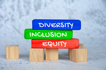 Diversity, inclusion and equity text on colorful wooden blocks. Business culture concept