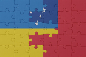 Fototapeta premium puzzle with the national flag of ukraine and Samoa . macro.concept.
