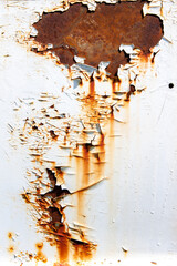 Rusted white painted metal wall. Rusty metal background with streaks of rust.