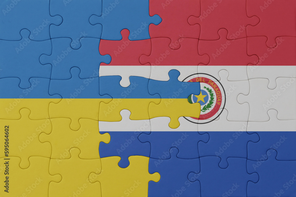 Wall mural puzzle with the national flag of ukraine and paraguay . macro.concept. - Wall murals