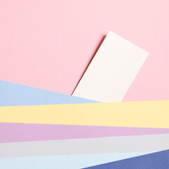 Holiday concept. card for invitation, anniversary , birthday party. frame, mockup copy space. colorful papers on pink background. square