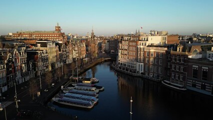 Sunrise flight over The Amstel river in Amsterdam, Netherlands