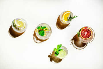 Gin tonic citrus and herb cocktails set, top view. Assortment of summer drinks for cocktail party....