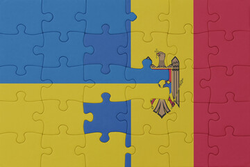 puzzle with the national flag of ukraine and moldova . macro.concept.