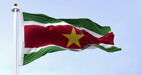 Suriname national flag waving in the wind on a clear day