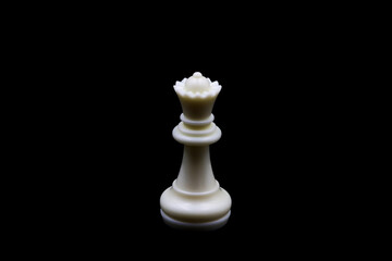 Chess piece of the white queen, on black background