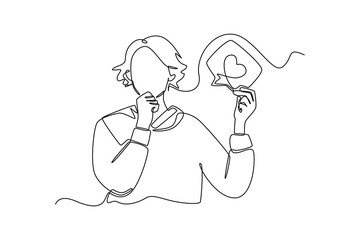Single one line drawing happy woman holding social media love icon. Social media concept. Continuous line draw design graphic vector illustration.