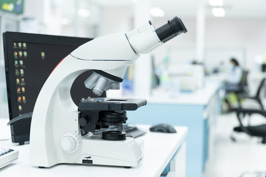 Selective focus microscope in laboratory unit.Modern medical research laboratory with microscopy on the desk.Health scientific lab biotechnology department center.Medical healthcare technology concept
