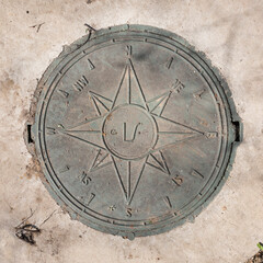 compass on the manhole cover