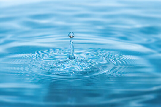 Blue water drop falling down. Water resources