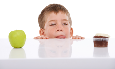 Face, choice and kid with apple and cupcake on isolated, png and transparent background. Childhood, unhealthy eating and young boy with food, cake and decision for dessert, fruit and luxury treats
