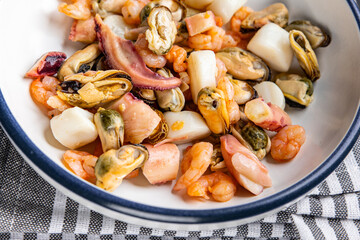 seafood cocktail food salad shrimp, mussel, scallop, octopus meal snack on the table copy space food background rustic top view 