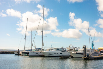 Fototapeta premium Boats moored to pontoons in Poole Harbour in Dorset, UK