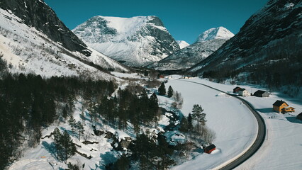 Mountain road in Norway at winter time. Panoramic view.