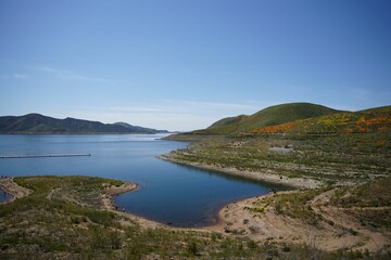 Body of water with a mesmerizing blue-green hue, inviting the viewer to take a refreshing dip