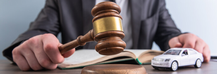 Model of car and gavel.