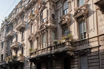Fototapeta na wymiar classic facade of stately building in milan in residential district