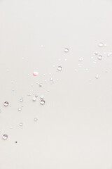 sequins on beige background 