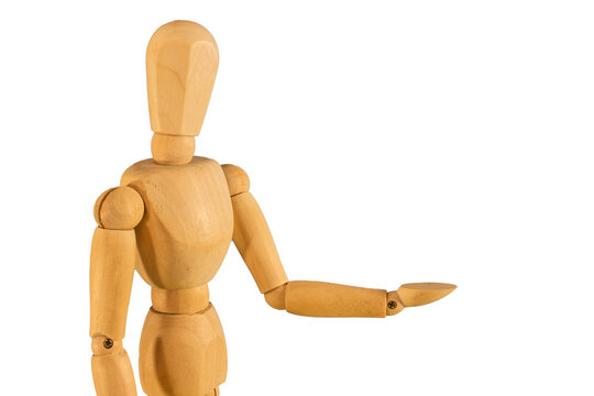 A wooden doll with its hand outstretched.
