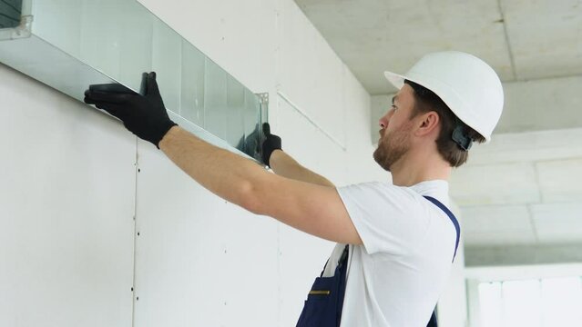 Hvac worker install ducted pipe system for ventilation and air conditioning