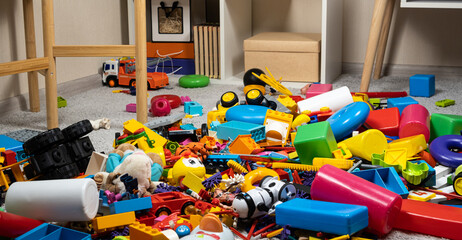 An abundance of toys in the children's room, a lot of plastic multi-colored parts from designers,...