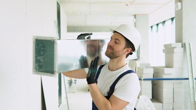 Funny hvac worker with ventilation pipe during a break