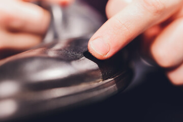 Brushes, wax, boots. applying cream with your finger. Shoe repair.