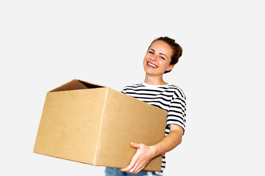 Isolated woman holding a big  cardboard box in her hands on white background, moving, relocation concept.