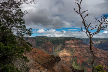Fototapeta na wymiar Waimea Canyon, also known as the Grand Canyon of the Pacific on the western side of Kauaʻi in the Hawaiian Islands, USA
