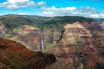 Waimea Canyon waterfall, also known as the Grand Canyon of the Pacific on the western side of...