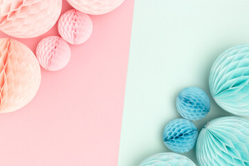 Frame made of tissue paper balls in a pink and blue colors. Gender reveal party concept with place for text.