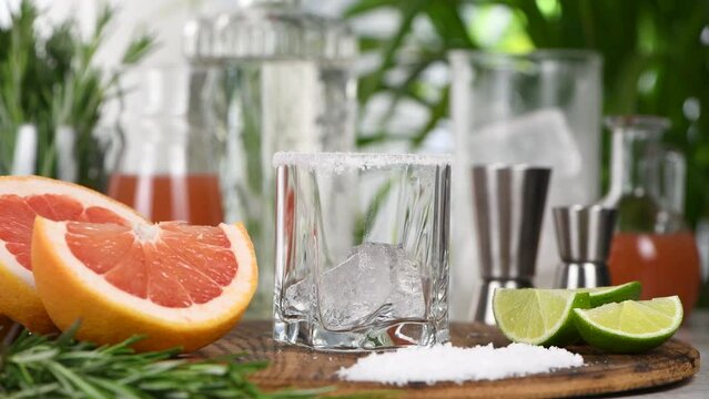 Cocktail Pink Paloma, prepared from the juice of freshly squeezed red grapefruit, lime, silver tequila. Refreshing organic cocktail. Step by step recipe for making a drink.