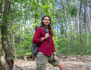 Long hair man in forest