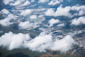 An airplane view of clouds symbolizes freedom, imagination, and perspective. The vast expanse of the sky inspires awe and wonder, offering a sense of detachment from the daily grind 