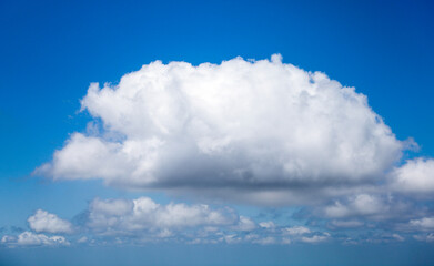 An airplane view of clouds symbolizes freedom, imagination, and perspective. The vast expanse of...